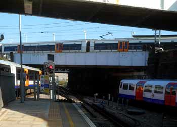 Overground Underground trains at Willesden Junction.