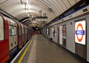Pimlico station name sign illuminated from behind.